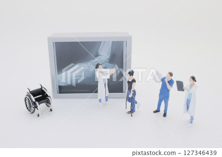 Mini Doctors Analyzing Medical X Rays in Clinical Setting Mini Doctors Analyzing Medical X Rays in Clinical Setting 127346439