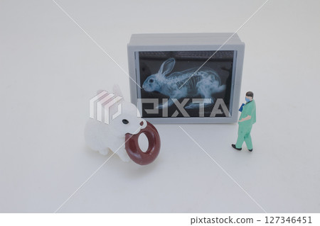 Mini Doctors Analyzing Medical X Rays in Clinical Setting Mini Doctors Analyzing Medical X Rays in Clinical Setting 127346451
