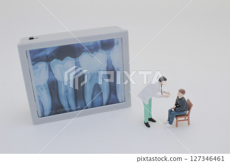 Mini Doctors Analyzing Medical X Rays in Clinical Setting Mini Doctors Analyzing Medical X Rays in Clinical Setting 127346461