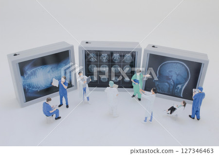 Mini Doctors Analyzing Medical X Rays in Clinical Setting Mini Doctors Analyzing Medical X Rays in Clinical Setting 127346463