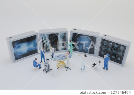 Mini Doctors Analyzing Medical X Rays in Clinical Setting Mini Doctors Analyzing Medical X Rays in Clinical Setting 127346464
