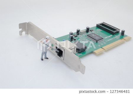 Miniaturized Worker Interacting With Computer Network Card Miniaturized Worker Interacting With Computer Network Card 127346481