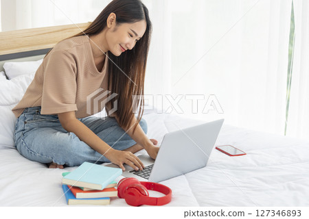Empty Green Screen laptop Blogger Woman hands typing Laptop computer keyboard. Close up women hands using laptop sitting sofa living room. Freelance women work from home office video call conference 127346893