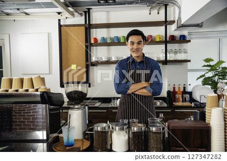 Portrait barista Asian man coffee shop owner smiling look at camera small business confident person Entrepreneur manager professional men standing coffee counter bar. Barista small business Owner 127347282