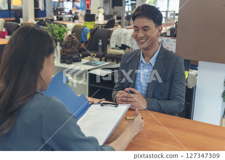 Job Interview with headhunter agent and applicant. Job HR applicants having an interview with Human resource manager jobs interviewing with confident candidate at business firm office give cv resume 127347309