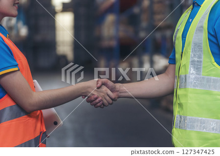 Close up warehouse worker shakehand together. Engineer man hands partnership. Diversity Coworker Men logistics Warehouse teams handshake. Multiracial Support team greeting person teamwork colleagues Close up warehouse worker shakehand together. Engineer man hands partnership. Diversity Coworker Men logistics Warehouse teams handshake. Multiracial Support team greeting person teamwork colleagues 127347425