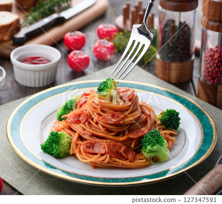 Warm broccoli and bacon pasta with tomato sauce Warm broccoli and bacon pasta with tomato sauce 127347591