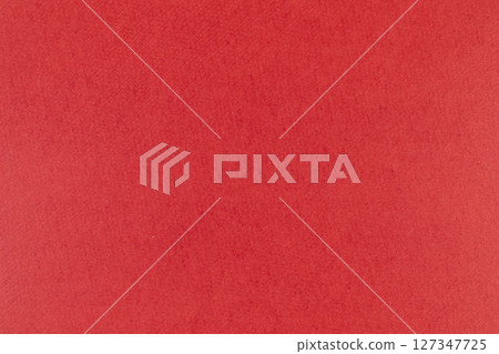 Red paper material with a rough texture 127347725