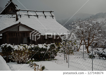 This photo was taken in Miyama-cho, Nantan-shi, Kyoto, in thatched roof village covered with snow. This photo was taken in Miyama-cho, Nantan-shi, Kyoto, in thatched roof village covered with snow. 127348674