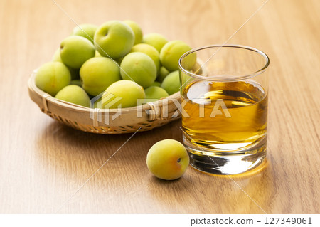 Homemade plum wine and green plums Homemade plum wine and green plums 127349061