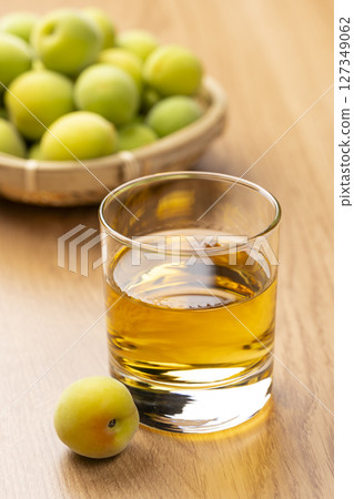 Homemade plum wine and green plums Homemade plum wine and green plums 127349062