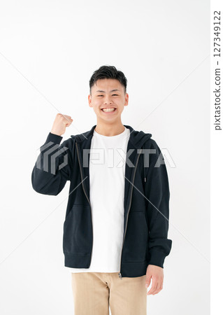 Young man portrait casual fist pump Young man portrait casual fist pump 127349122