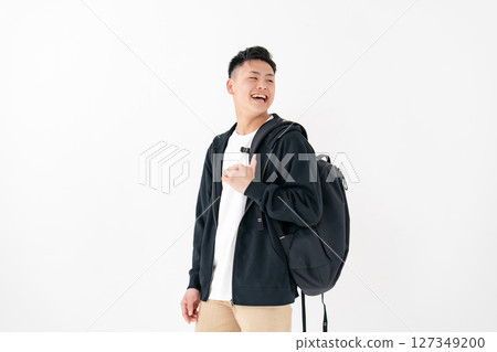 Young man portrait backpack 127349200