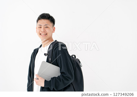 Young man portrait backpack tablet 127349206