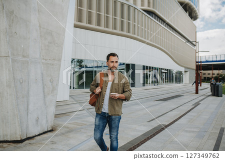 Portrait of confident middle-aged man standing outdoors. 127349762