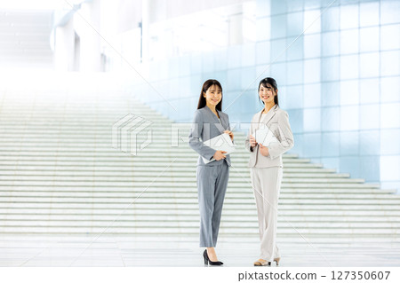Business woman with laptop Business woman with laptop 127350607