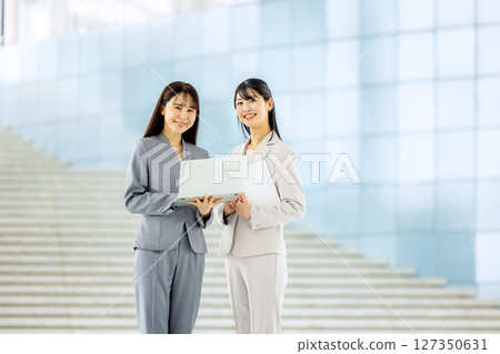 Business woman with laptop Business woman with laptop 127350631
