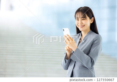Young business woman, smartphone Young business woman, smartphone 127350667
