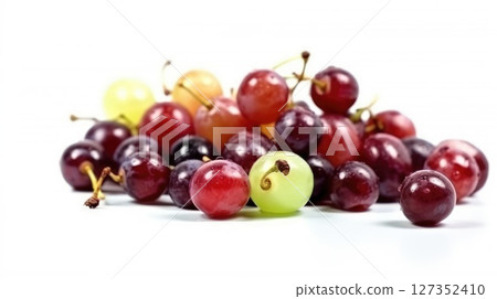 Fresh Assortment of Colorful Grapes and Cherries on White Background 127352410