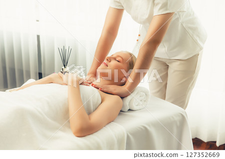 Caucasian woman customer enjoying relaxing anti-stress massage. Quiescent Caucasian woman customer enjoying relaxing anti-stress massage. Quiescent 127352669
