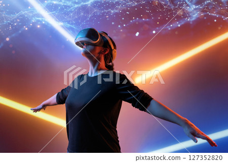 Woman with VR virtual reality goggles 127352820