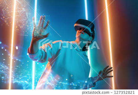 Woman with VR virtual reality goggles 127352821