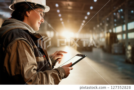 Young woman is working in warehouse 127352828