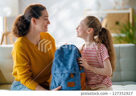Happy family preparing for school 127352927