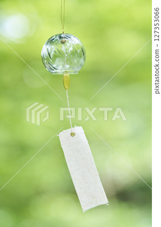 Wind chimes swaying in the wind under the summer sunlight 127353066