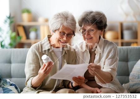 women are taking medication at home 127353532