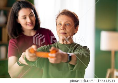 Senior woman doing dumbbell exercise Senior woman doing dumbbell exercise 127353934