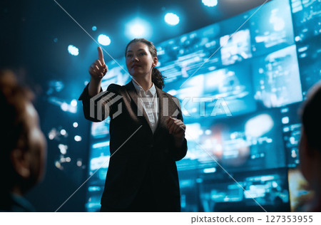 A woman is speaking on stage 127353955