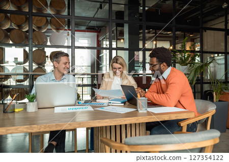 Layers working in the office and looking busy and contented 127354122