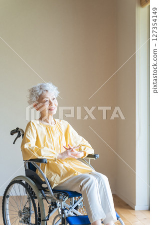 Senior woman relaxing in a wheelchair 127354149