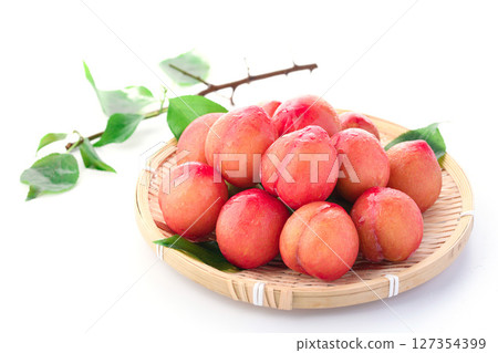 Sweet and sour and delicious plum (early) on white background Sweet and sour and delicious plum (early) on white background 127354399