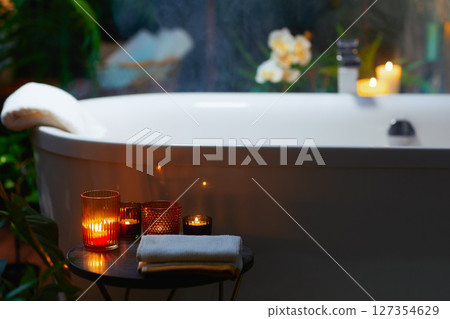 Luxurious Candlelit Bathtub in a Serene Bathroom Luxurious Candlelit Bathtub in a Serene Bathroom 127354629