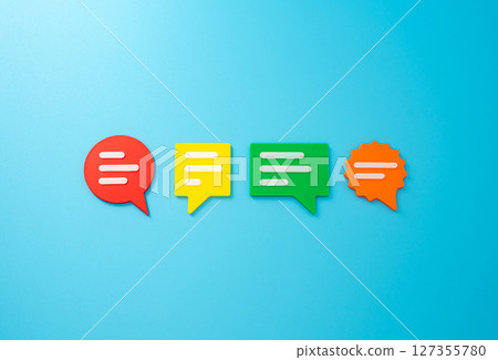 Conversation clouds on blue background. Different points of view, opinions and ideas. Discussion and communication. Open dialogue. Concept of communication, discussion, workplace or social interaction 127355780