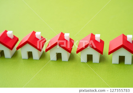 A row of houses. Buying or selling a home. Real estate market. A row of houses. Buying or selling a home. Real estate market. 127355783