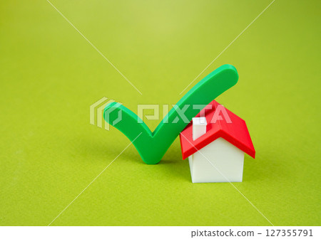 House and green check mark. Residence verification. The best choice of housing. Legally ready to buy or sell housing. Best choice for buying or renting a property. 127355791