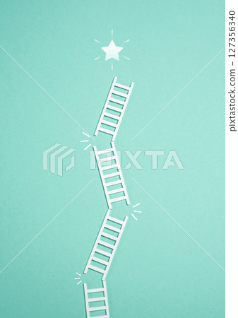 Falling ladder from the success star. Failure to achieve success. Thorny path. Difficult journey, setbacks on the path to achievement, or missed opportunities in personal or professional growth. 127356340