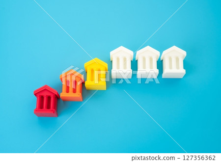 A sequence of collapsing bank buildings signifies systemic financial collapse, banking crisis, or widespread bankruptcy. A sequence of collapsing bank buildings signifies systemic financial collapse, banking crisis, or widespread bankruptcy. 127356362