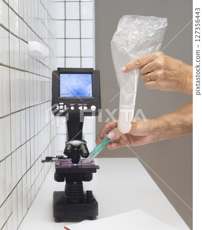 microscope and sperm in clinic microscope and sperm in clinic 127356443