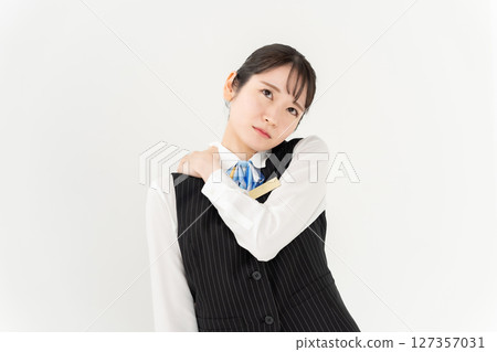 Woman in uniform, business, stiff shoulders Woman in uniform, business, stiff shoulders 127357031