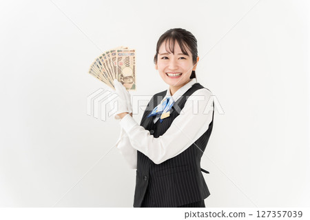 A woman with money 127357039