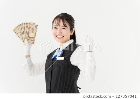 Woman with money, fist pump 127357041