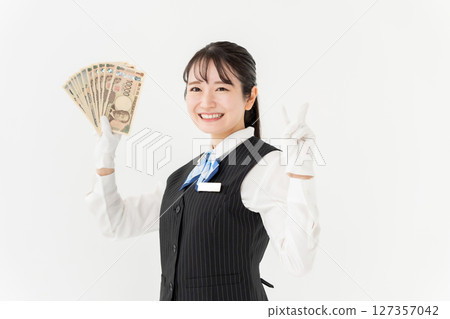 Woman with money Peace sign 127357042