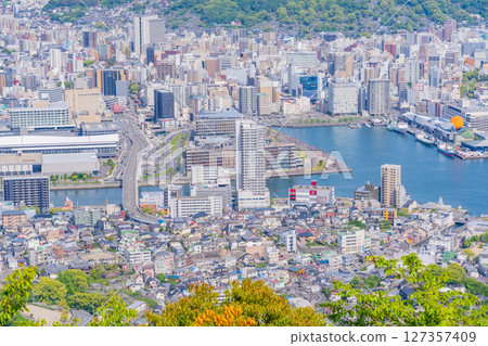 (Nagasaki Prefecture) The cityscape in front of Nagasaki Station as seen from the observation deck at the top of Mount Inasa (Nagasaki Prefecture) The cityscape in front of Nagasaki Station as seen from the observation deck at the top of Mount Inasa 127357409