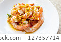 Spicy Shrimp Salad with Garlic chilli fish sauce and lemon in a plate 127357714