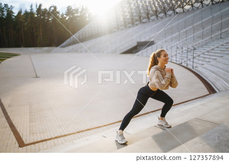 Woman, fitness and stretching in city getting ready for workout. People, sport concept Woman, fitness and stretching in city getting ready for workout. People, sport concept 127357894