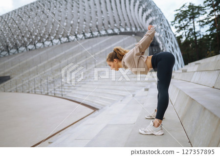 Woman, fitness and stretching in city getting ready for workout. People, sport concept 127357895